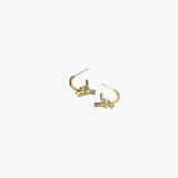 Linked Knot Hoop Earrings in 18K gold plated finish with silver knot detail and polished sculptural design.