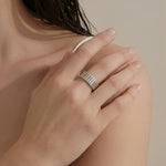 Minimal ridge band ring worn on hand with a clean modern design