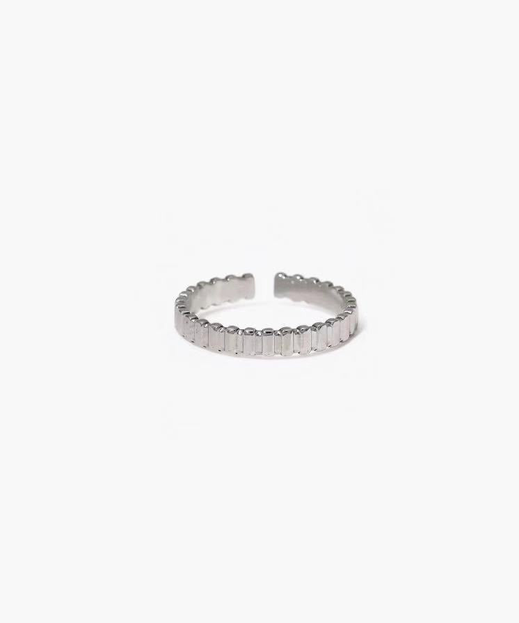 Block Line Ring in stainless steel with evenly spaced block segments and an adjustable open band