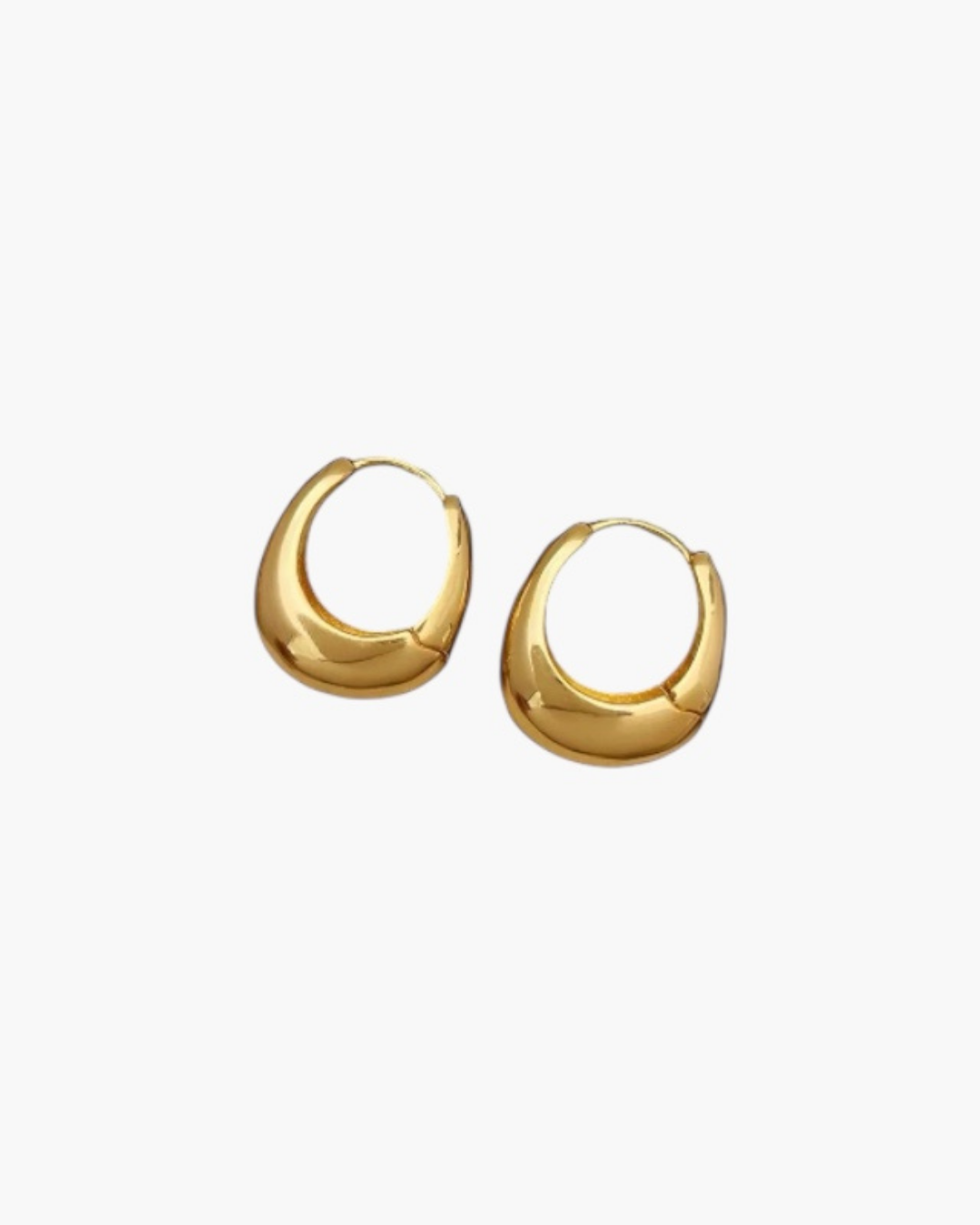 Bold Curve Hoop Earrings in 18k gold plated stainless steel with smooth curved silhouette.

