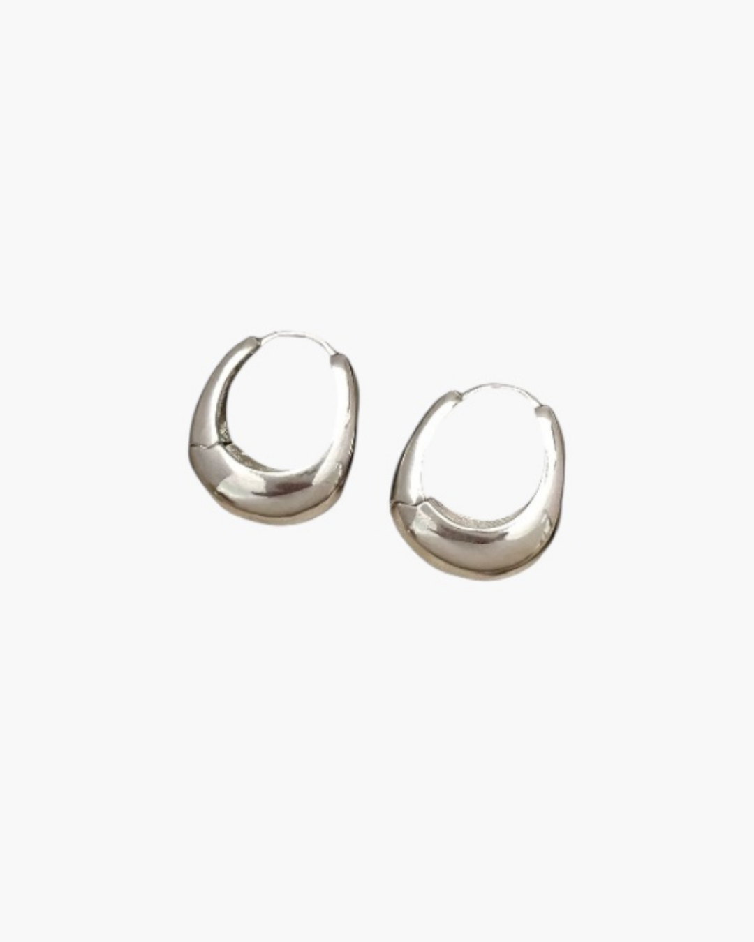 Bold Curve Hoop Earrings in silver stainless steel with smooth sculpted rounded design.