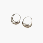 Bold Curve Hoop Earrings in silver stainless steel with smooth sculpted rounded design.