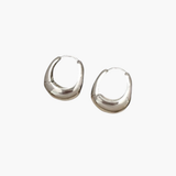 Bold Curve Hoop Earrings in silver stainless steel with smooth sculpted rounded design.