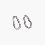 Calm Oval Earrings in stainless steel featuring an irregular textured oval silhouette.