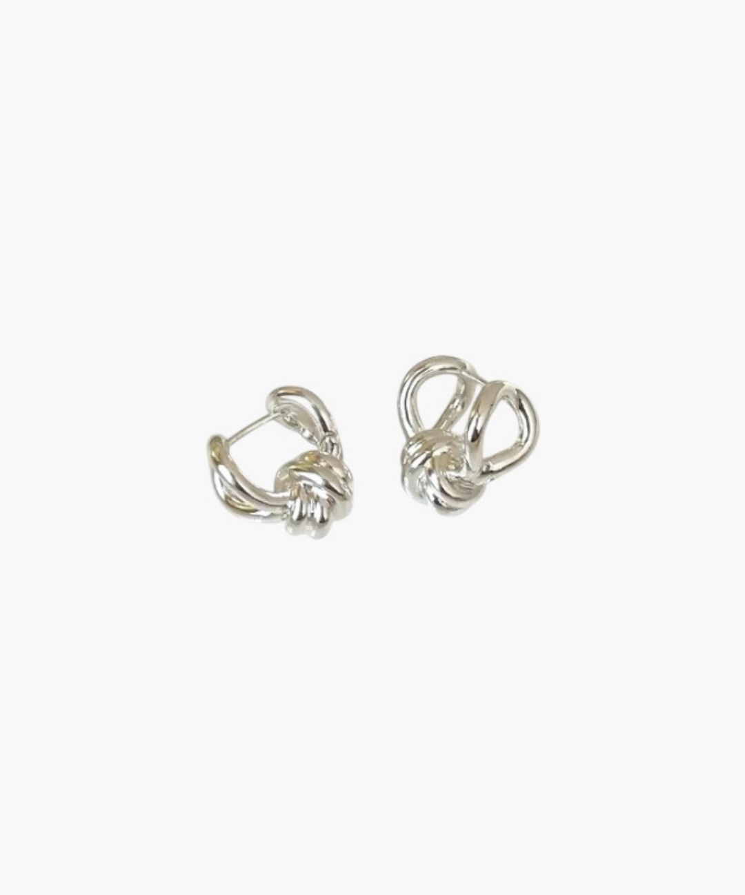 Compact Knot Earrings in stainless steel with sculptural interwoven knot detail.
