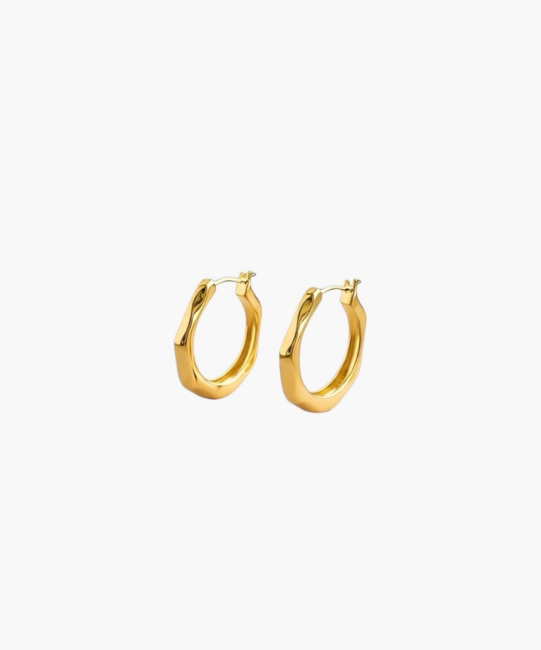 Contour Twist Hoop Earrings in 18K gold plated finish with a polished softly contoured hoop design.
