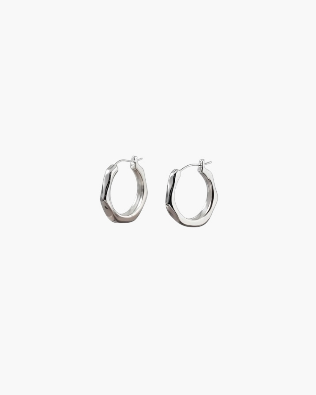 Contour Twist Hoop Earrings in platinum plated finish featuring a modern twisted hoop with high-polish shine.