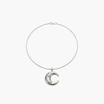 Minimalist crescent moon pendant necklace with smooth sculpted moon charm.