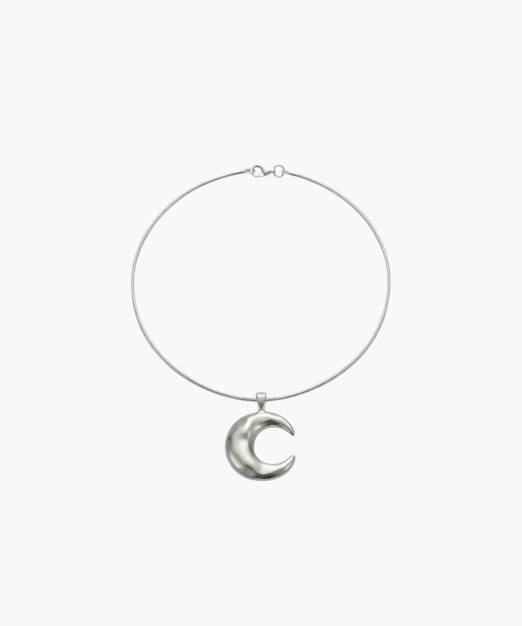 Minimalist crescent moon pendant necklace with smooth sculpted moon charm.