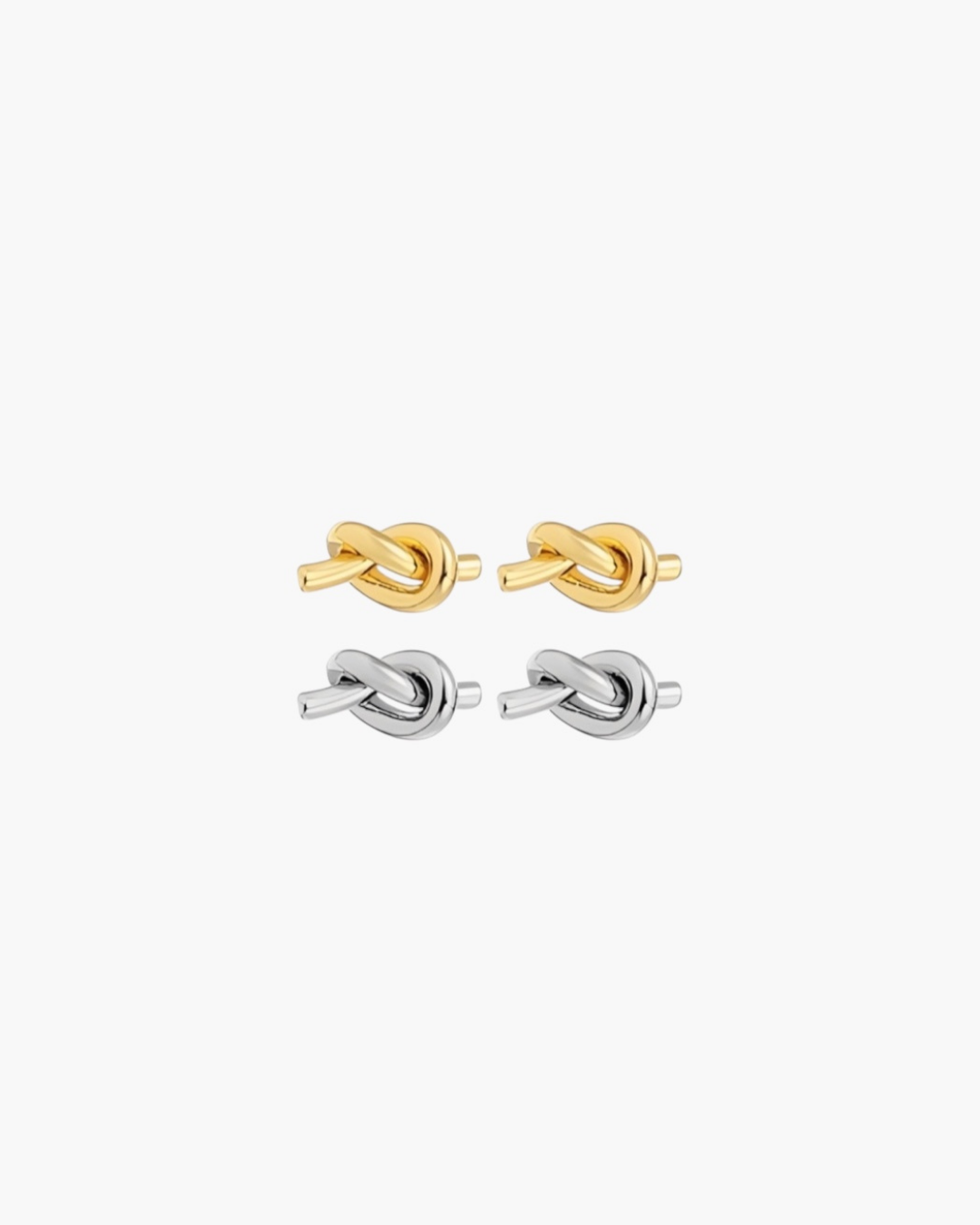 Essential Knot Stud Earrings in gold and silver finishes with polished sculptural knot design.