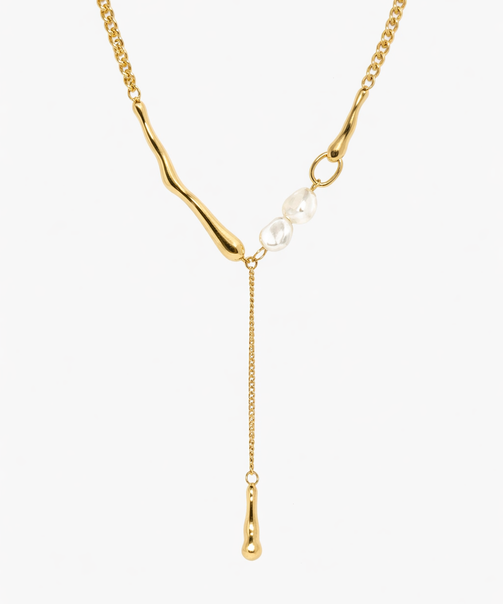 Gold pearl drop Y necklace with delicate chain and teardrop pendant detail.
