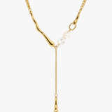 Gold pearl drop Y necklace with delicate chain and teardrop pendant detail.

