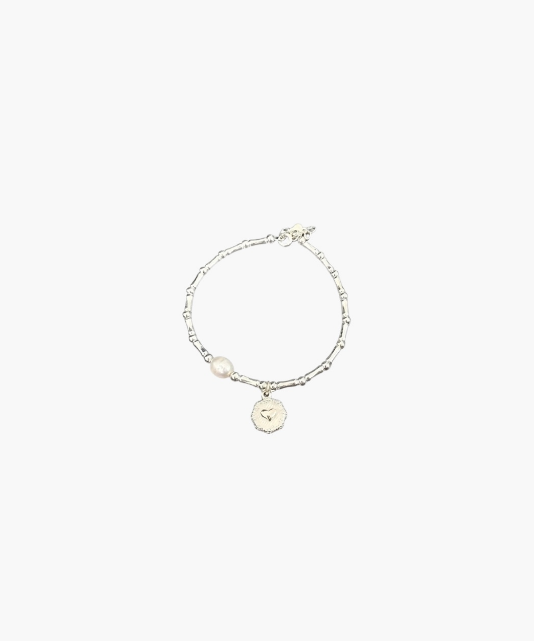 Minimal silver bracelet with heart coin charm by About Ease.