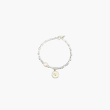 Minimal silver bracelet with heart coin charm by About Ease.
