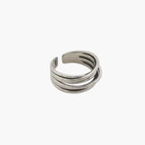 Layered Curve Ring in stainless steel with overlapping curved bands and an adjustable open design