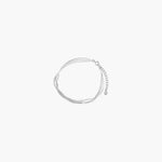 Layered silver flow bracelet with delicate multi-strand design and adjustable chain closure.
