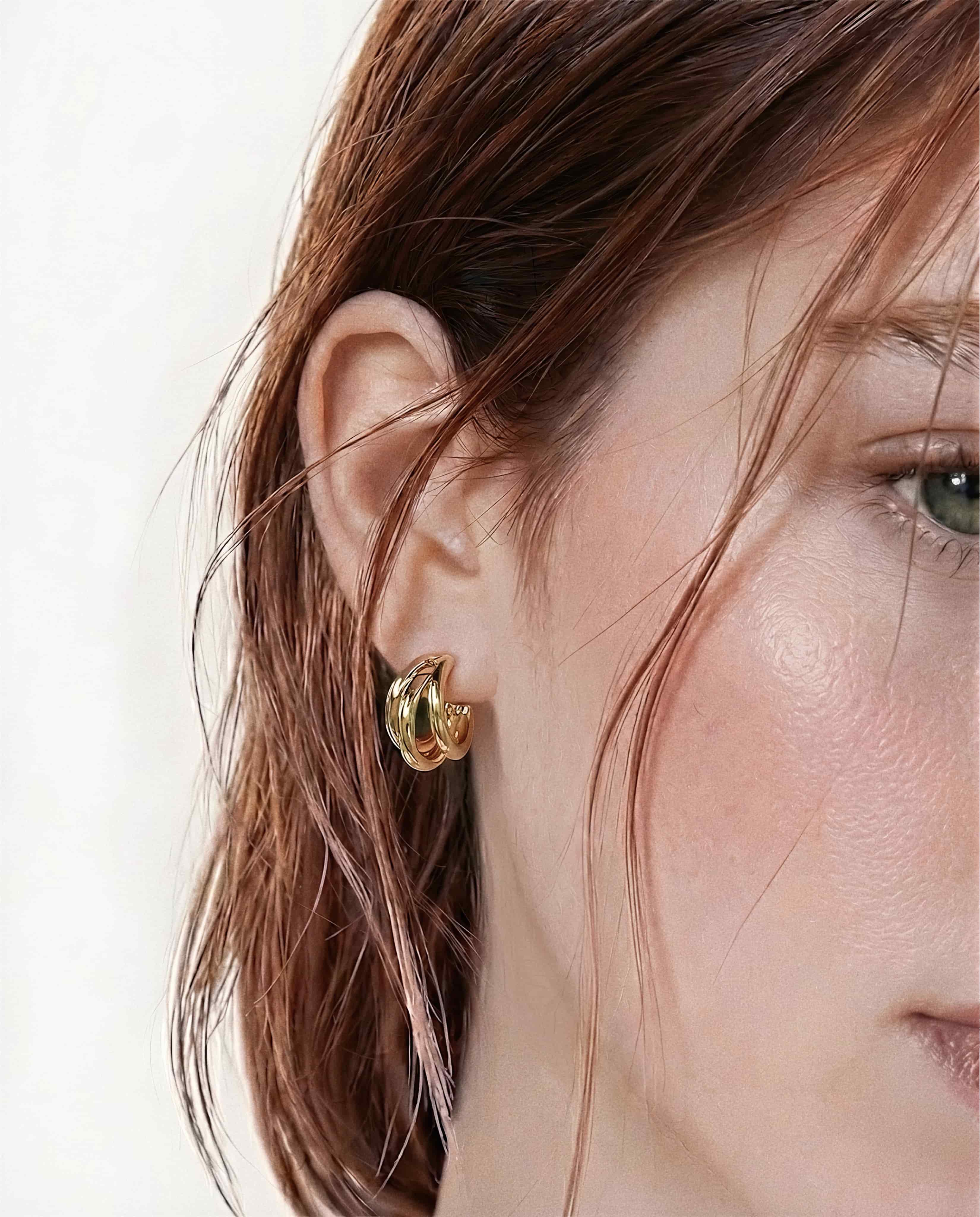Interlaced loop stud earrings in 18k gold plated finish, rounded polished minimalist layered gold earrings for women.