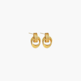 Side view of Layered Link Stud Earrings in silver plated finish showcasing the sculptural interlocking ring detail.
