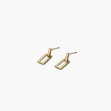 Gold linear frame drop earrings shown in angled view highlighting the open rectangular design.