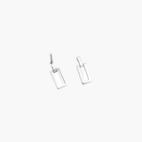 Silver linear frame drop earrings in angled view with modern open rectangle shape.
