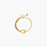 18K gold plated linked chain bracelet with layered chains and oval link detail.
