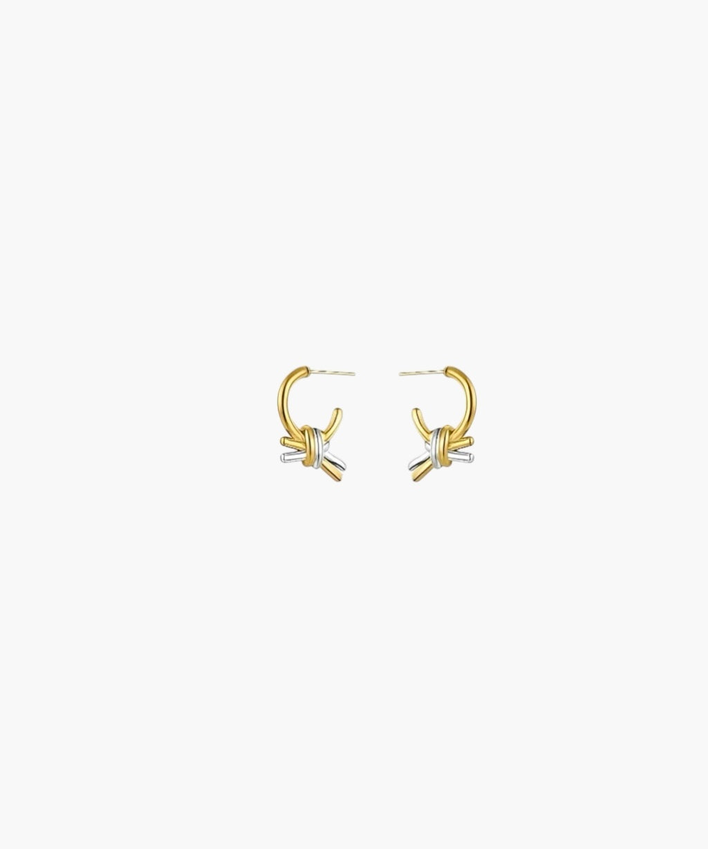 Front view of Linked Knot Hoop Earrings featuring interlocking gold and silver knot accents on a polished hoop.