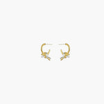 Front view of Linked Knot Hoop Earrings featuring interlocking gold and silver knot accents on a polished hoop.