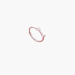 Minimal bow ring with elegant knot design and delicate style.