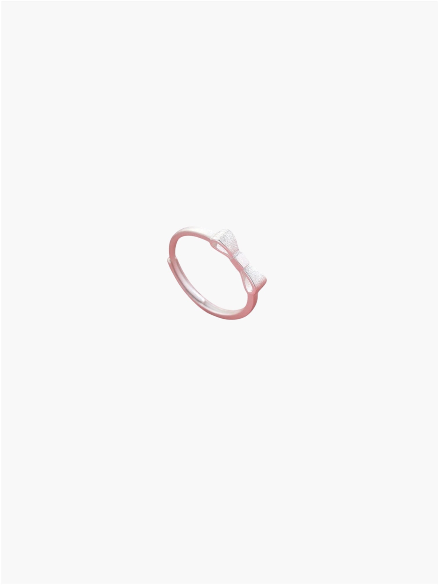 Minimal bow ring with elegant knot design and delicate style.