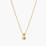 Minimal gold drop pendant necklace with polished teardrop charm on delicate chain.
