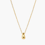 Minimal gold drop pendant necklace with polished teardrop charm on delicate chain.
