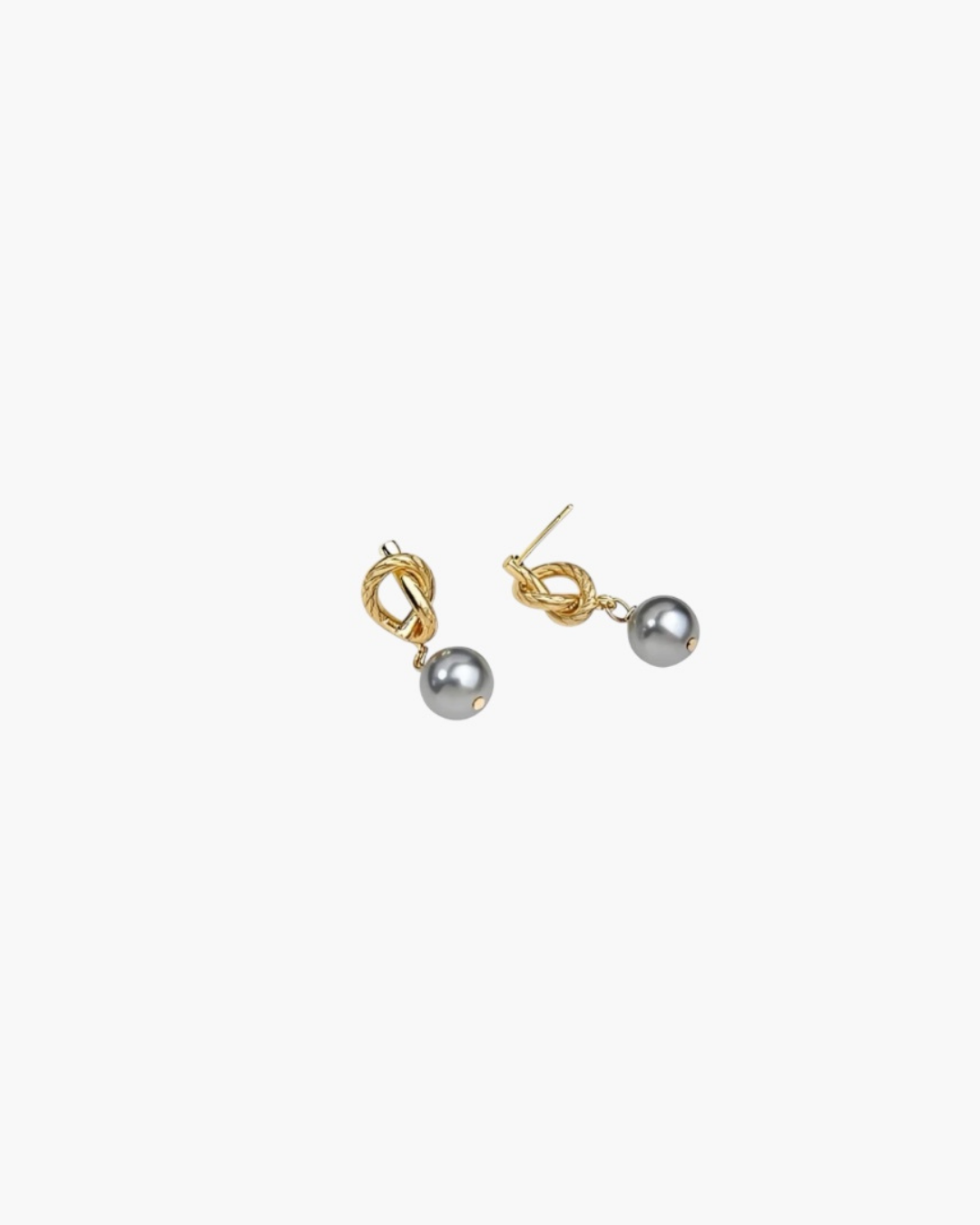 Modern Pearl Drop Earrings in 14k gold plated finish featuring a sculptural knot and gray pearl drop, angled view.