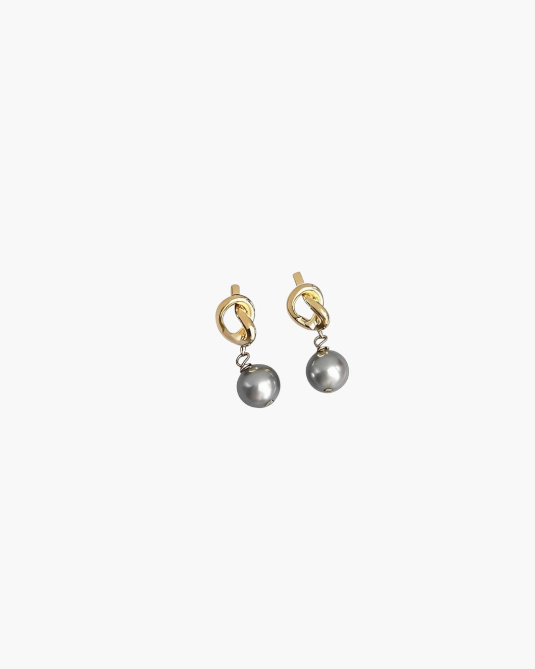 Modern Pearl Drop Earrings in 14k gold plated finish with sculptural knot detail and gray pearl drop, front view.