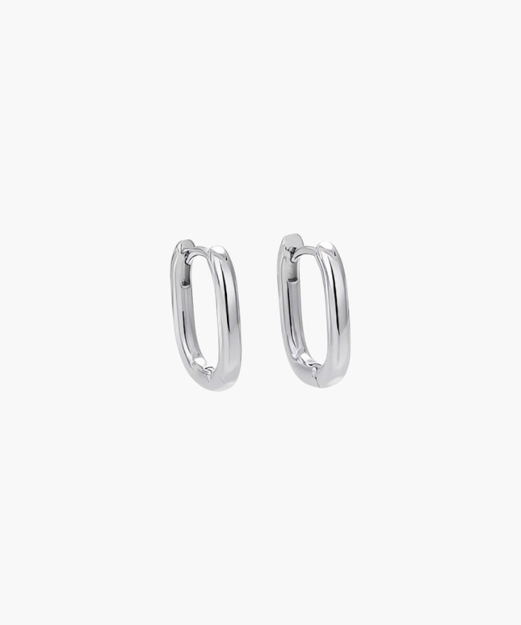 Oval Hoop Earrings in platinum plated finish featuring a sleek slim oval shape with high-polish shine.