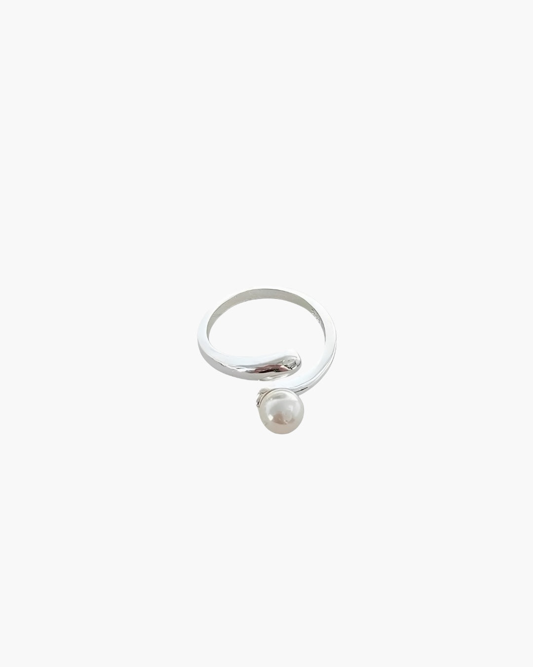 Minimalist pearl wrap ring with elegant open band and pearl accent.