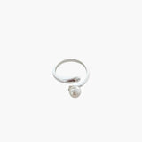 Minimalist pearl wrap ring with elegant open band and pearl accent.