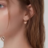 Quiet Pearl Hook Earrings worn on ear, minimalist hook earrings with a delicate pearl drop