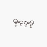 Refined bow stud earrings in 925 silver plated finish, minimalist sculpted bow earrings with polished modern design.