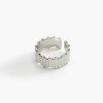 Ridge Band Ring in stainless steel with vertical ridged detailing and an adjustable open band