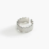Ridge Band Ring in stainless steel with vertical ridged detailing and an adjustable open band