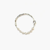 Minimal sculpted pearl bracelet with silver tone by About Ease