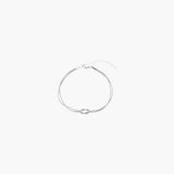 Minimalist silver knot line bracelet with double strand design and adjustable chain closure.
