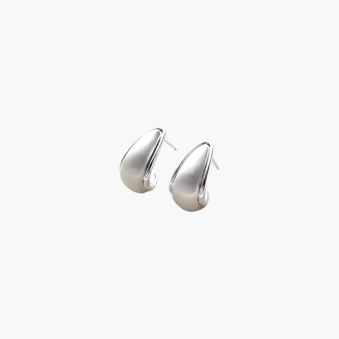 Soft Sculpt Stud Earrings in silver tone with smooth curved silhouette and polished finish.