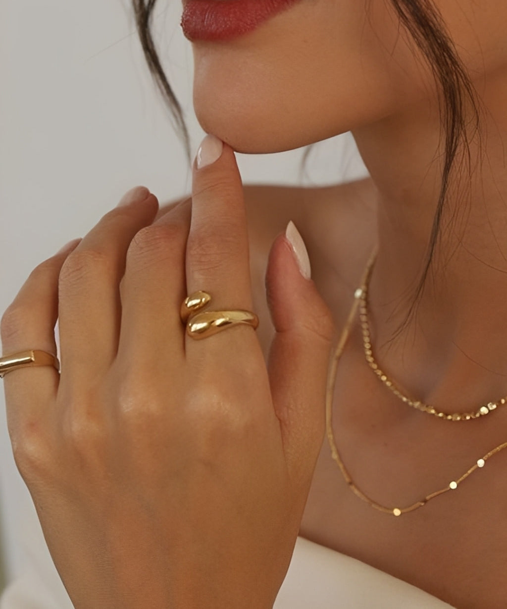 Soft Touch Ring in gold stainless steel, adjustable open ring with smooth rounded ends worn on hand.
