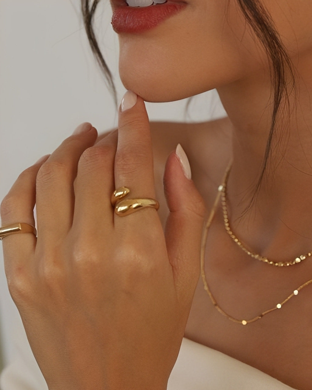 Soft Touch Ring in gold stainless steel, adjustable open ring with smooth rounded ends worn on hand.
