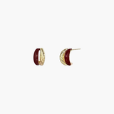 Twist Accent Stud Earrings in 18k gold plated finish with bold red accent detail, front view.