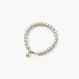 Minimal uniform pearl bracelet with gold accent by About Ease