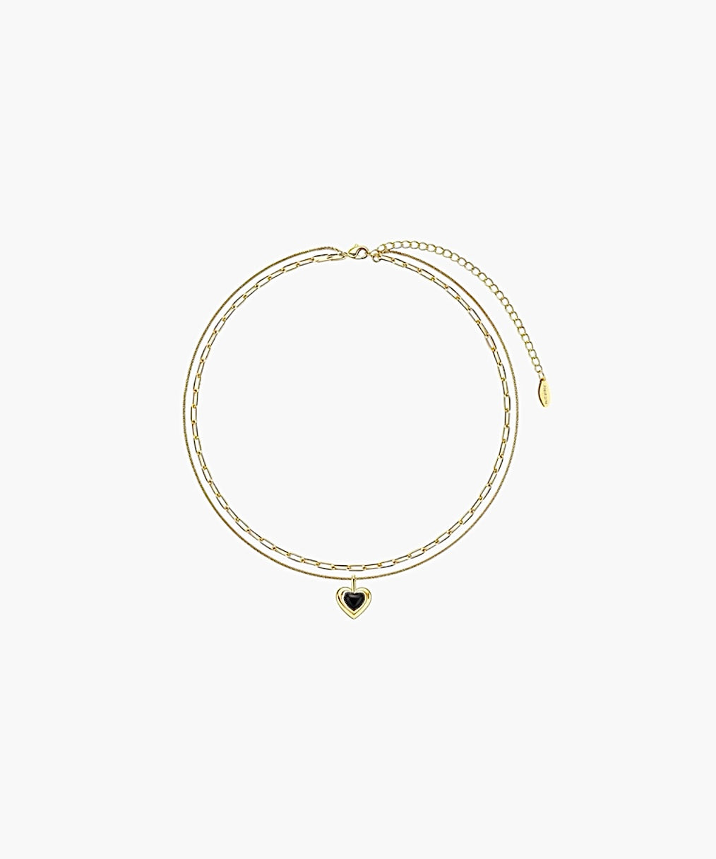 Vintage black heart layered necklace with delicate double chain and heart pendant.
