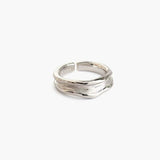 Worn Edge Ring in 925 silver plated finish with an organic textured surface and adjustable open band
