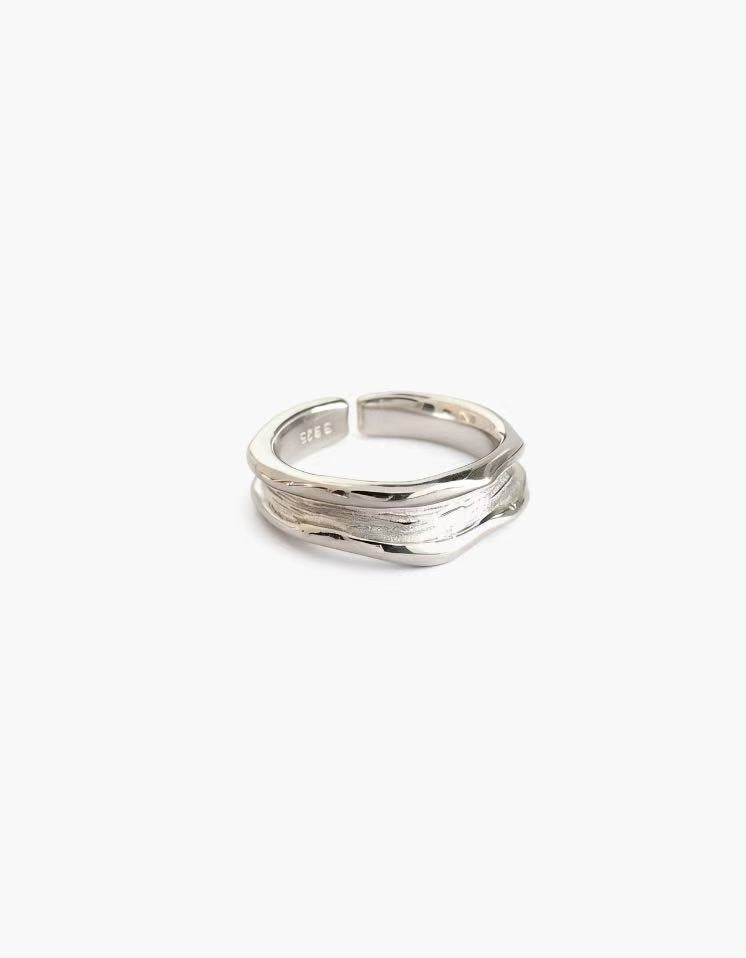 Worn Edge Ring in 925 silver plated finish with an organic textured surface and adjustable open band
